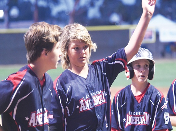 Batter up! It's time for Little League baseball summertime fun