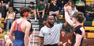 Mountain men crowd the wrestling award stand